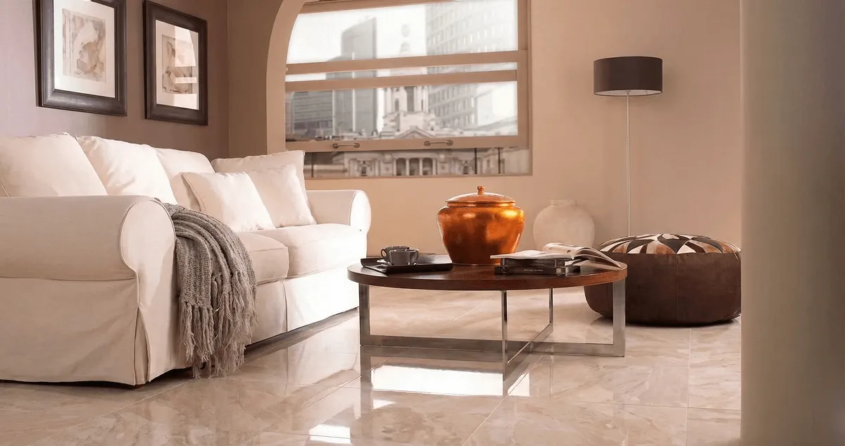 Modern living room with professionally installed marble flooring, a beige sofa, coffee table in Pueblo, CO